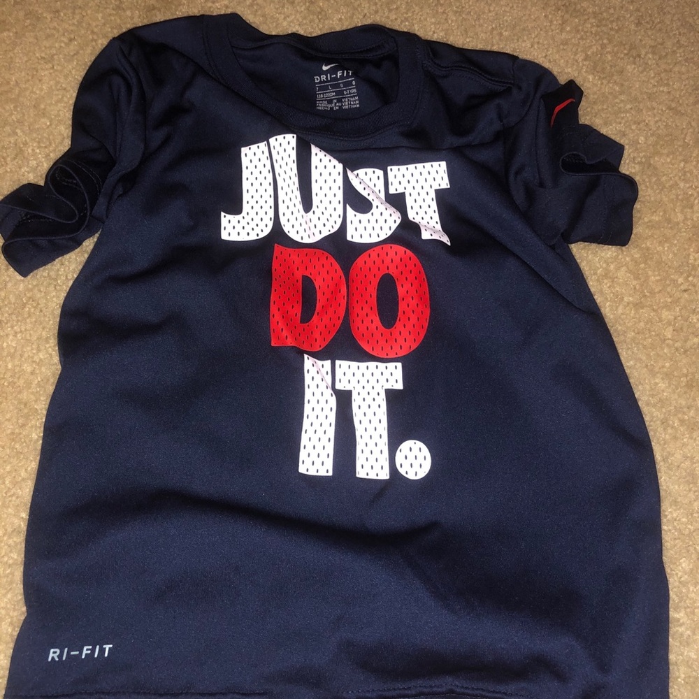 2 boys dri-fit t-shirts Nike and Under Armour